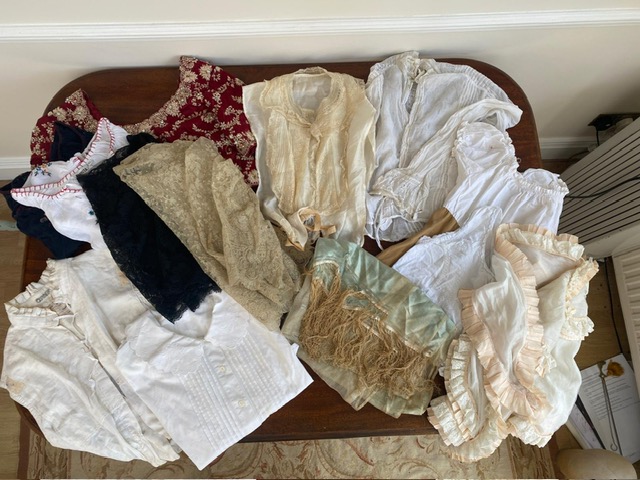 A vintage cotton night gown, a John Lewis night gown and over dressing gown with lace trim, plus mixed blouses some vintage and some with labels from the Royal Opera House